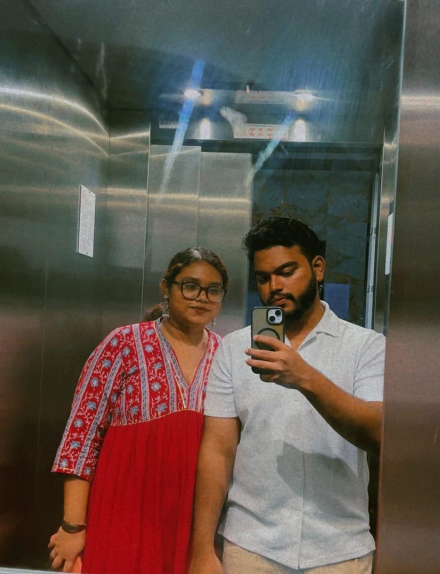 A mirror selfie of Jai with a friend in a lift