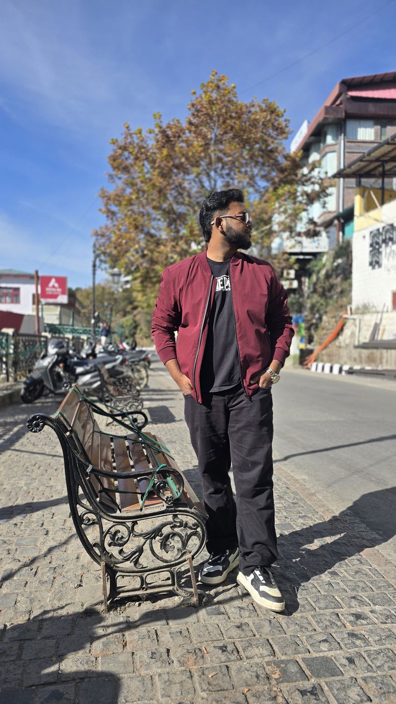 Jai standing on a cobbled street